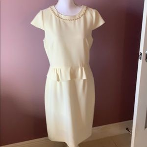 Tahari Cream Peplum Dress with Chain Accent.